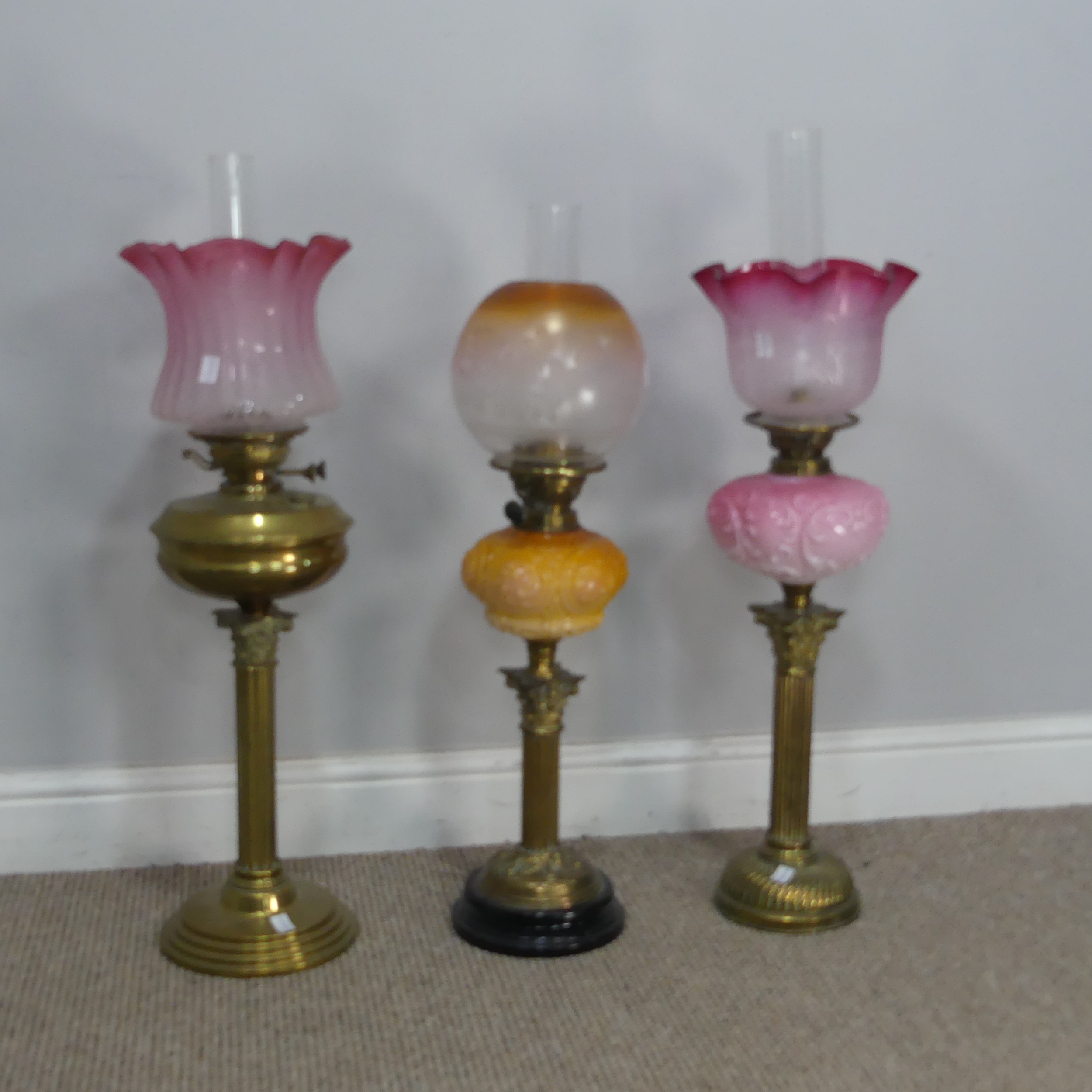 A Victorian Youngs brass Oil lamp, cranberry and etched glass shade raised on brass reservoir and - Image 3 of 4