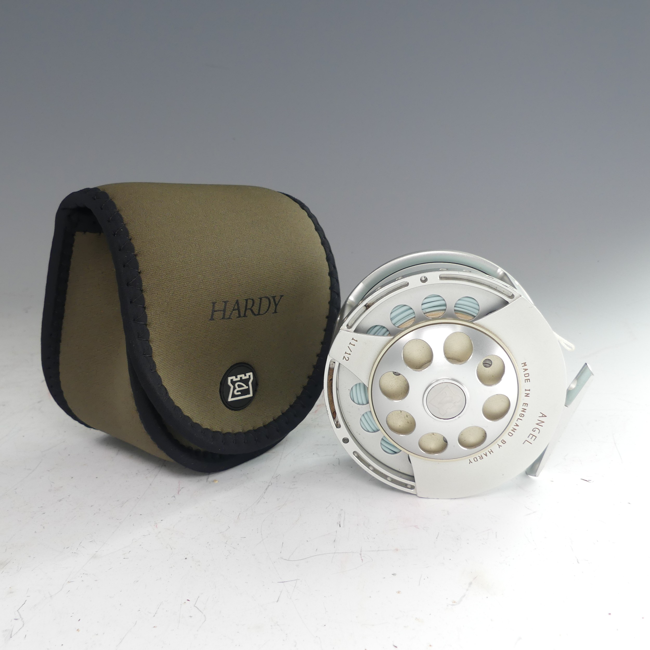 A Hardy Angel 11/12 fishing Reel, no. A26720, with Hardy pouch, 11.5cm diameter. - Image 4 of 5