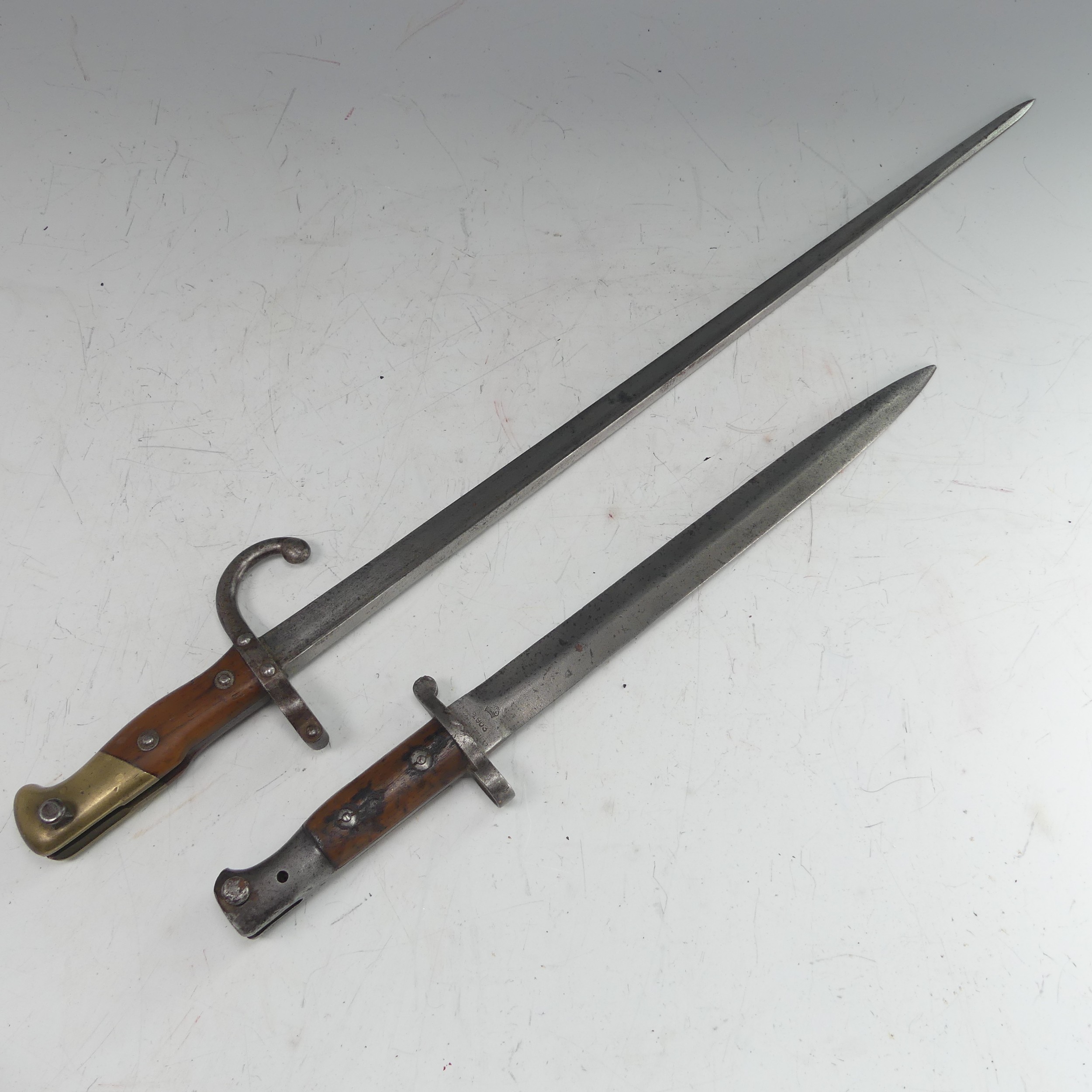 A 19th century French Gras Bayonet, marked the the spine '1879' to the hilt '04893', total length 65