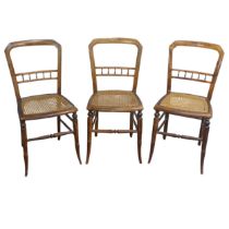 A set of three Edwardian possibly beech cane seated bedroom Chairs, with turned spindle bar backs, W