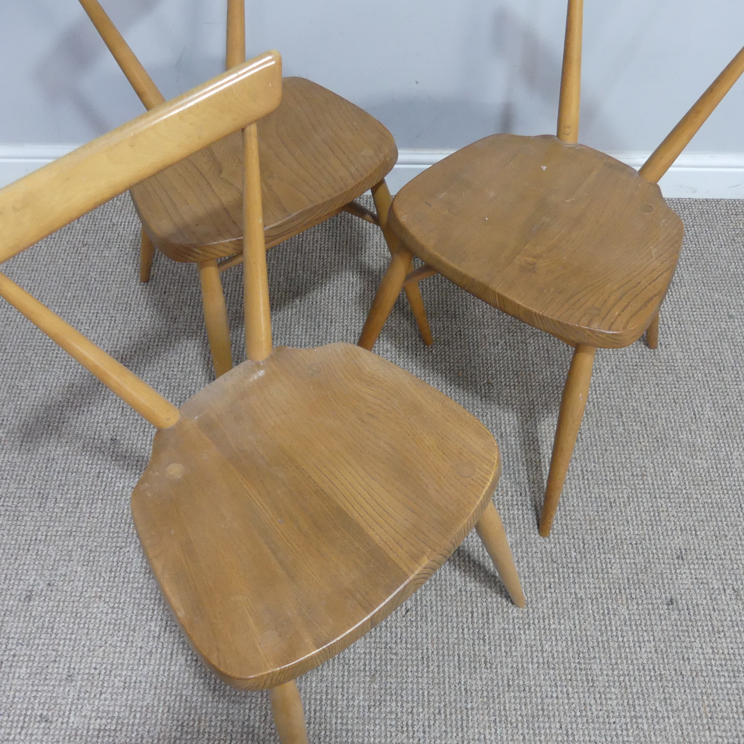 A set of three mid 20th century Ercol stacking Chairs, single slat backs over shaped seats and - Image 2 of 4