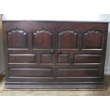 A large 18th century oak panelled Cupboard, raised on moulded plinth base, W 141 cm x H 95 cm x D 60