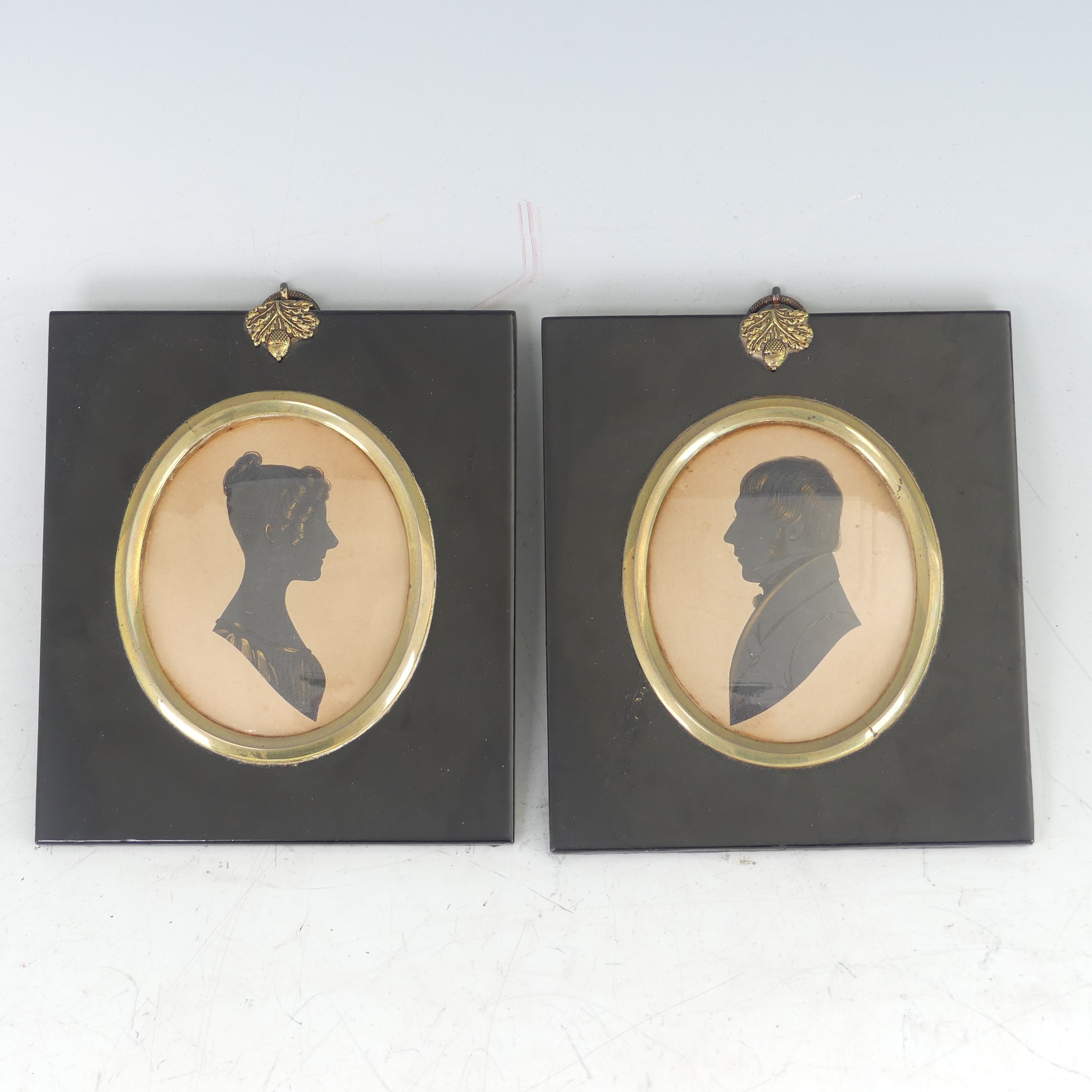 Pair of Victorian silhouette portraits, 'Thomas Oldham' and 'Mary Ann Oldham', painted on card,
