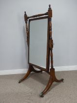 An antique Regency style mahogany Cheval Mirror, rectangular mirror plate, with ring turned supports