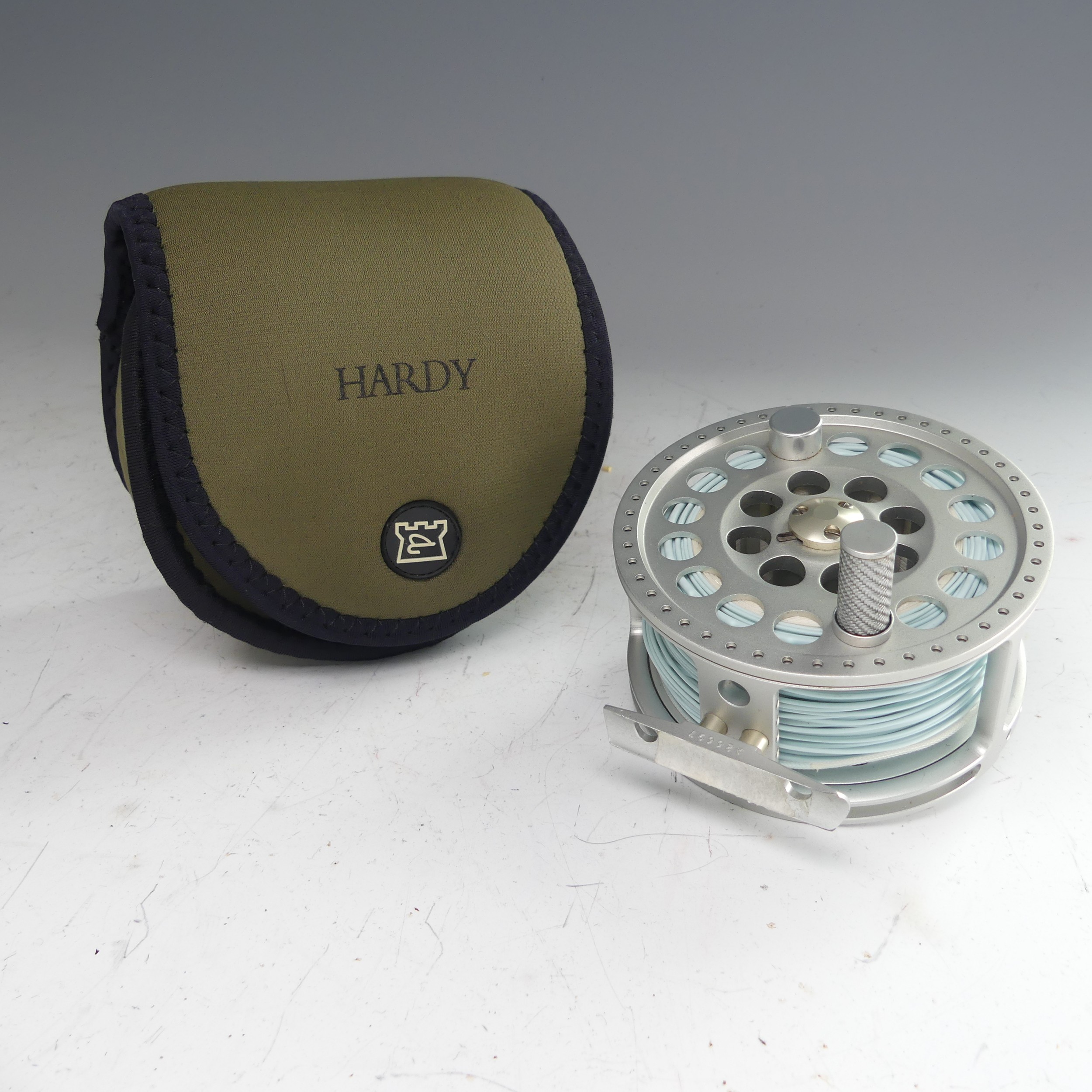 A Hardy Angel 11/12 fishing Reel, no. A26697, with Hardy pouch, 11.5cm diameter. - Image 3 of 8
