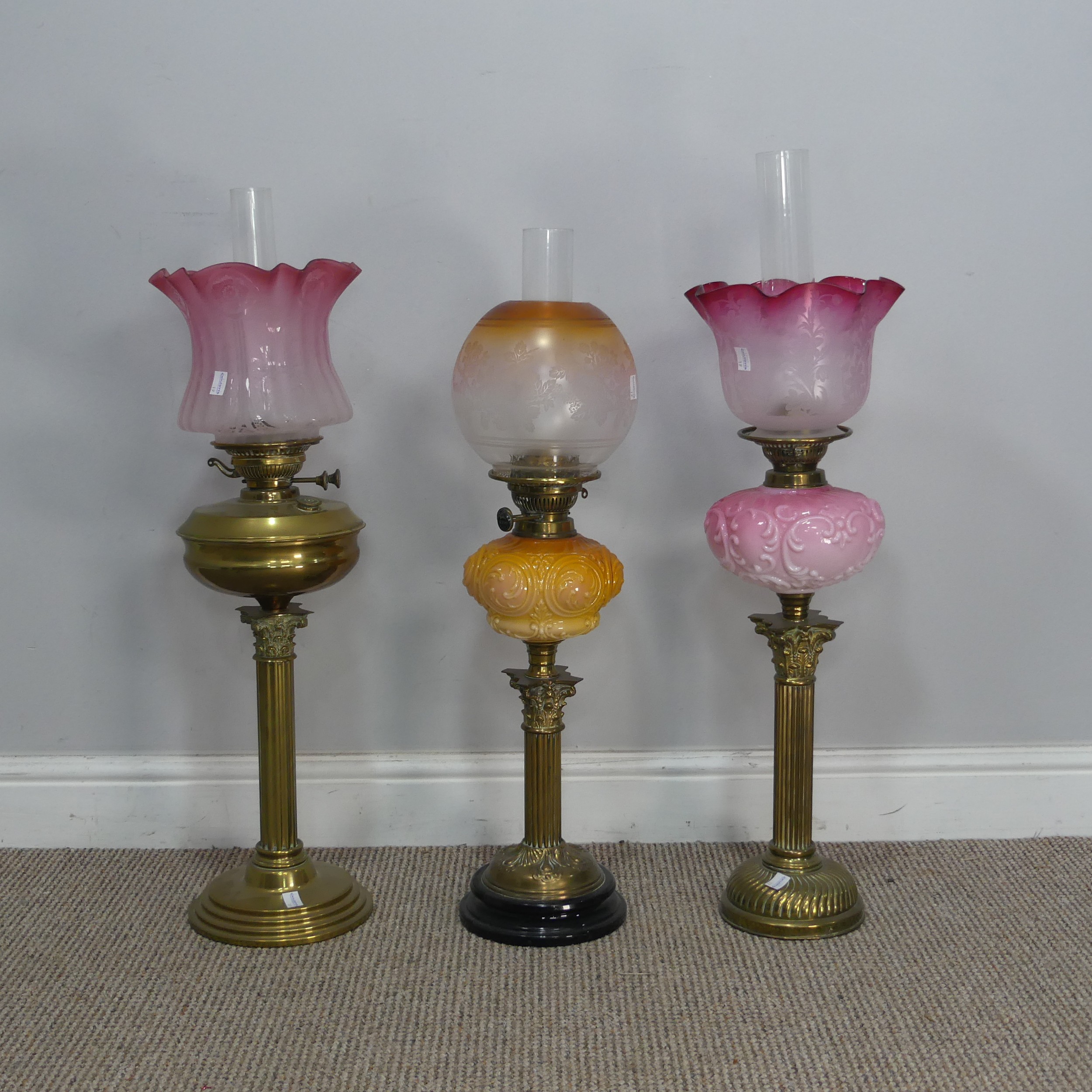 A Victorian Youngs brass Oil lamp, cranberry and etched glass shade raised on brass reservoir and - Image 2 of 4