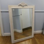 A painted rectangular wall Mirror, with carved pediment and bevelled plate, W 85.5 cm x H 130 cm.