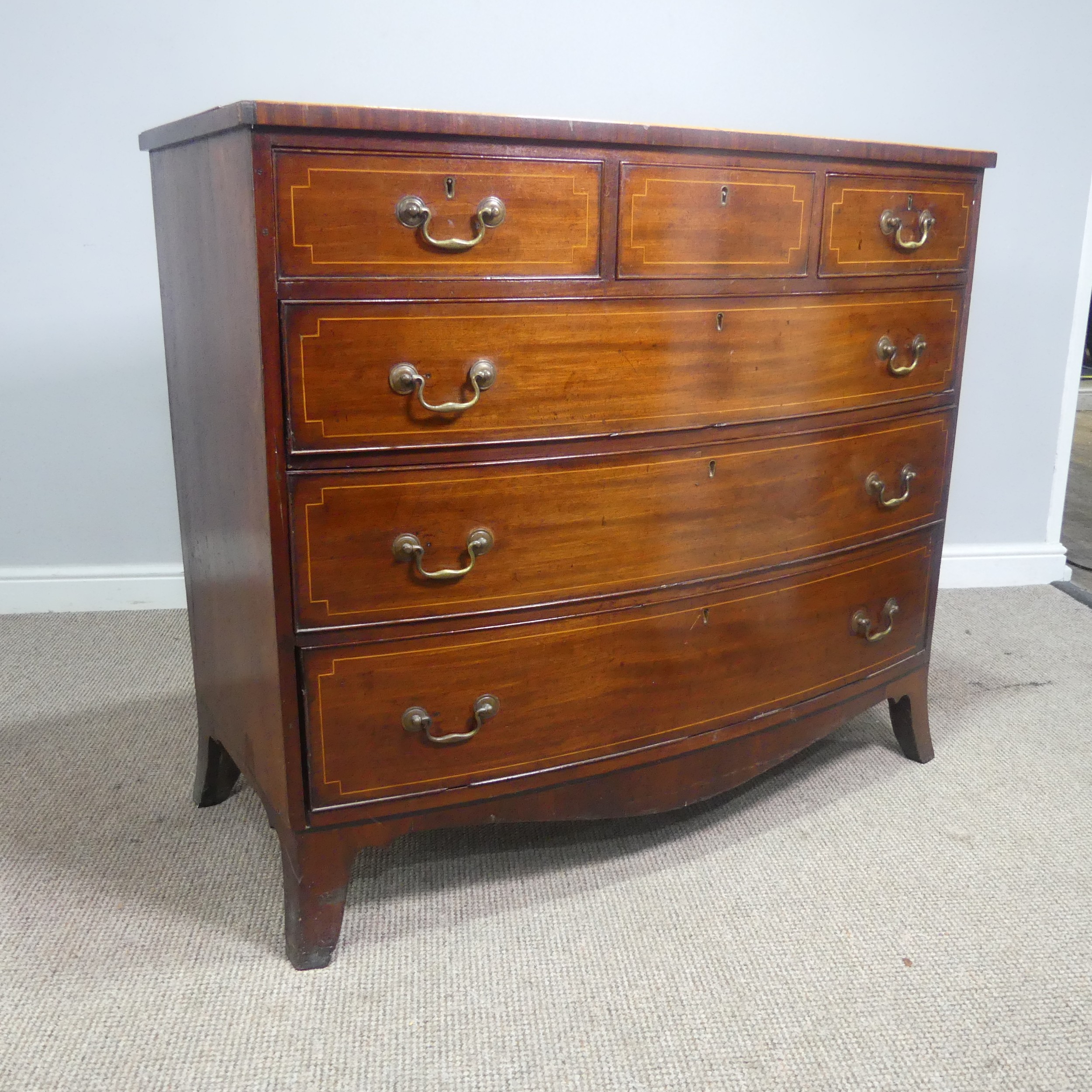 A Georgian mahogany bow-front Chest of drawers, three small drawers over three long graduating - Image 4 of 10