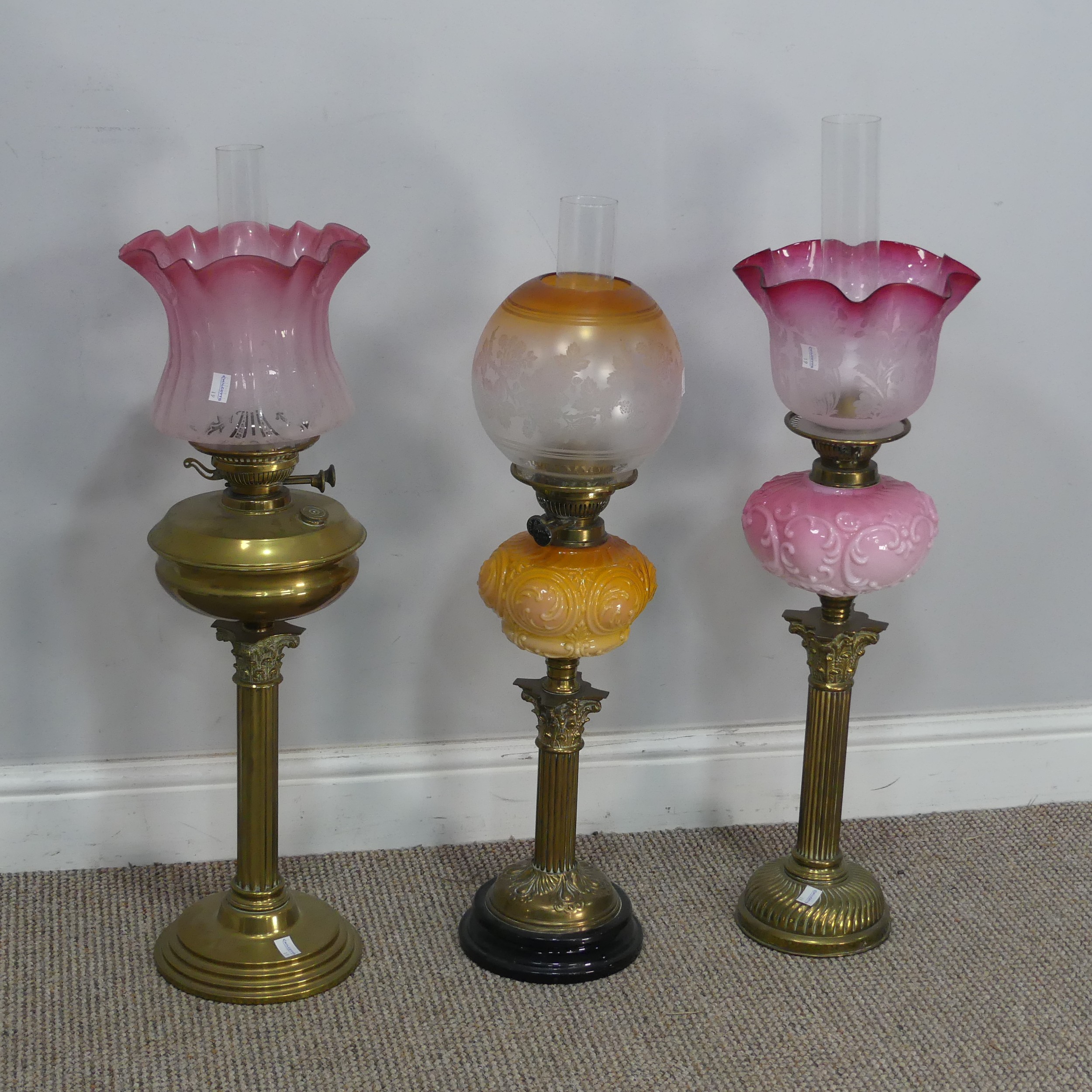 A Victorian Youngs brass Oil lamp, cranberry and etched glass shade raised on brass reservoir and - Image 4 of 4