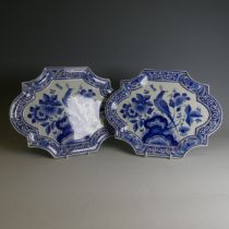 A pair of De Porceleyne Fles Delft pottery Plates, of moulded form, decorated with birds amongst