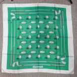 A Hermès silk twill scarf: Golf Design, green ground, hand rolled edges, with fabric composition and