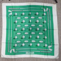 A Hermès silk twill scarf: Golf Design, green ground, hand rolled edges, with fabric composition and