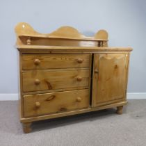 A Victorian pine 'Lincolnshire' Dresser, moulded top over three drawers and cupboard door, raised on