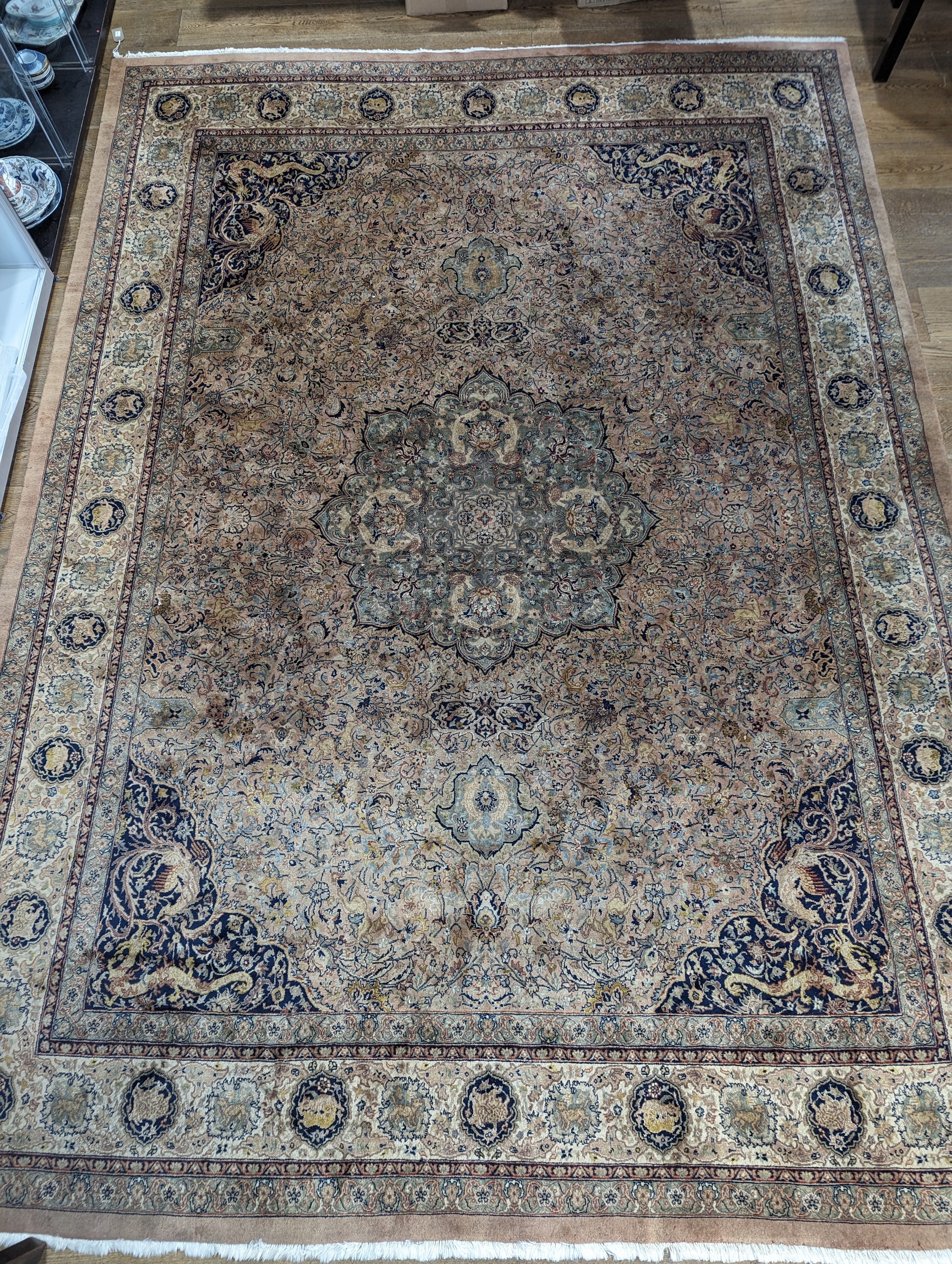 Tribal Rugs; a fine hand-knotted Persian Isfahan rug, wool pile on cotton base, buff ground woven