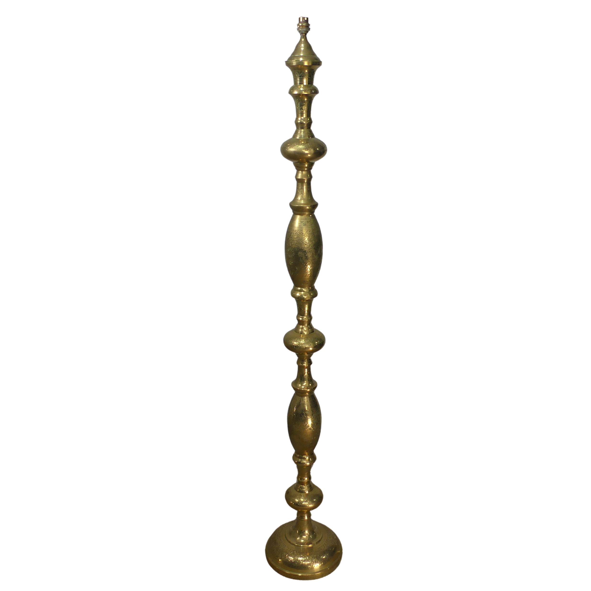 A heavily engraved brass standard Lamp, of baluster form, H 154 cm.