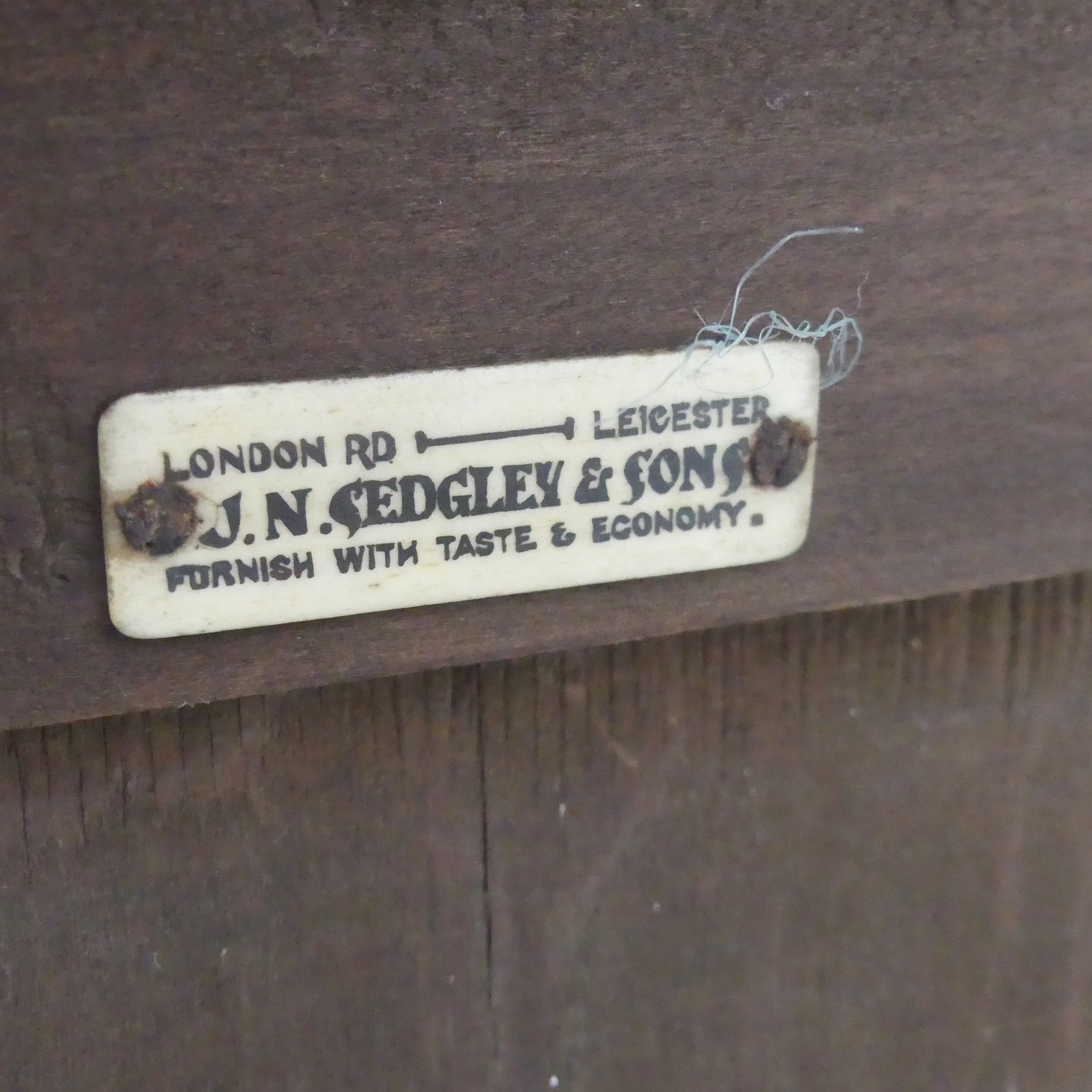 A Victorian carved oak open Bookcase, with retailers plaque, W 91 cm x H 116.5 cm x D 29.5 cm. - Image 4 of 4