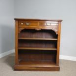An Edwardian mahogany open Bookcase, two short frieze drawers over two open shelves, raised on