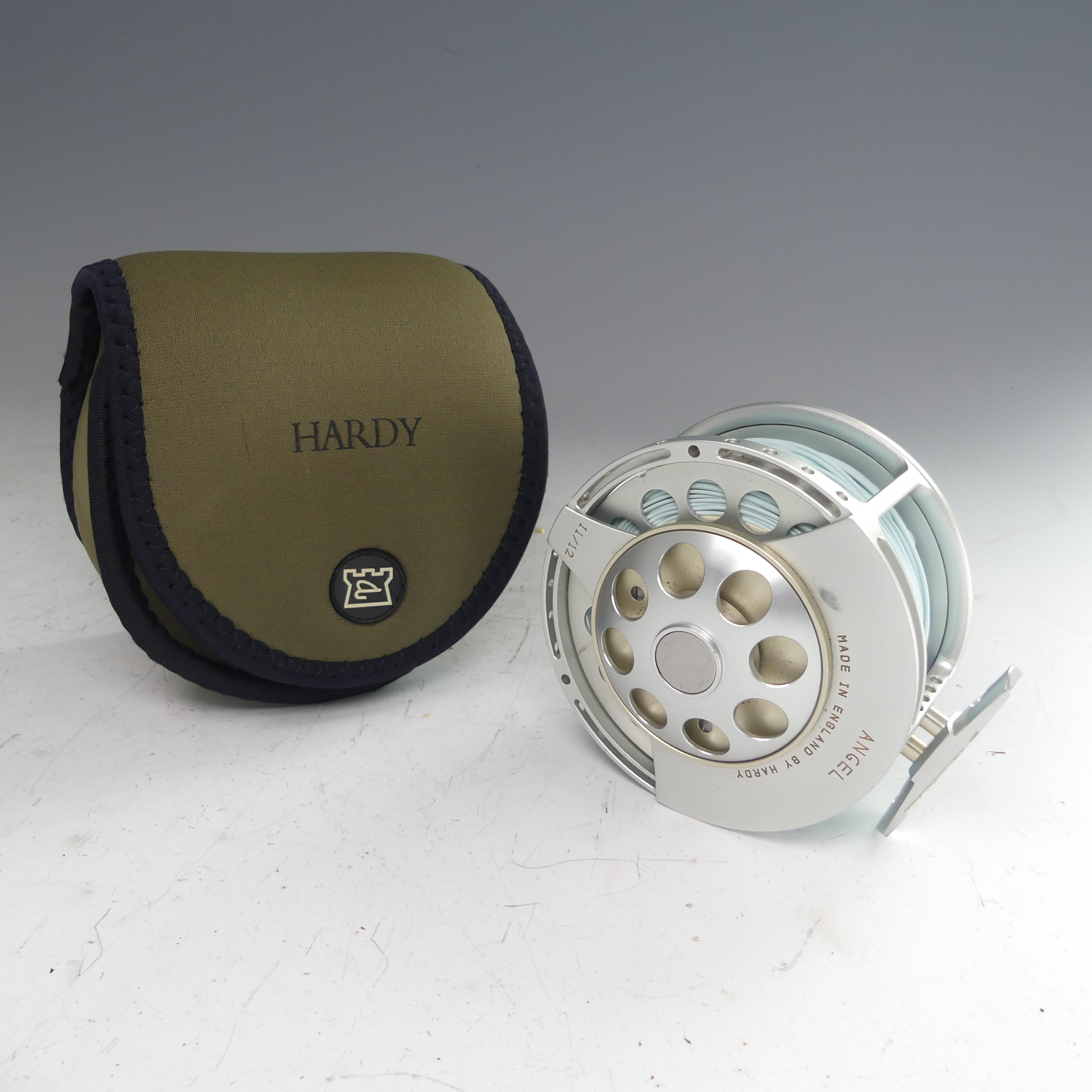 A Hardy Angel 11/12 fishing Reel, no. A26697, with Hardy pouch, 11.5cm diameter. - Image 5 of 8