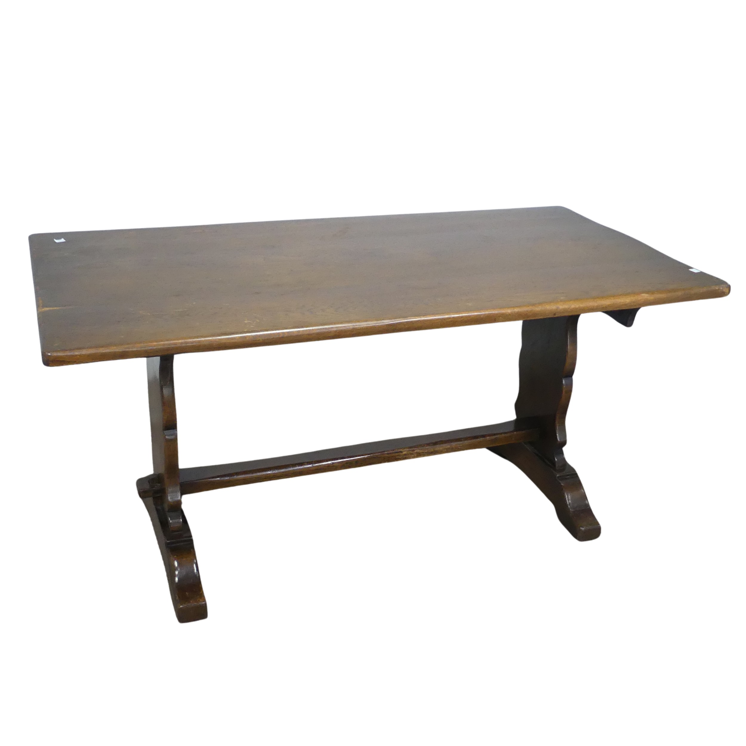A craftsman style oak refectory dining Table, retailed by 'Shepherd & Hedger, Southampton', label to