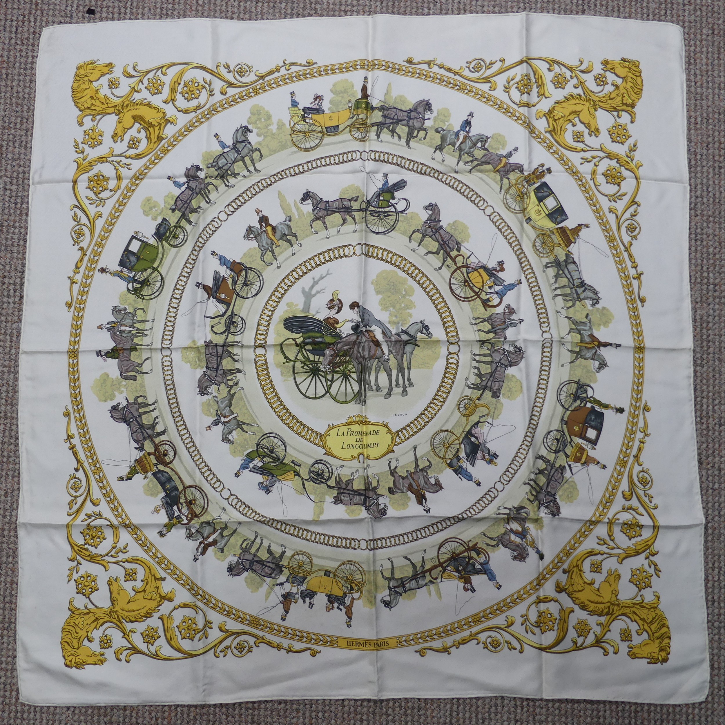 A Hermès silk twill scarf: 'La Promenade De Longchamps', designed by Philippe Ledoux, on cream