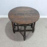 A small 18th century oak gateleg circular Table, raised on turned bobbin supports, W 99 cm x H 73 cm