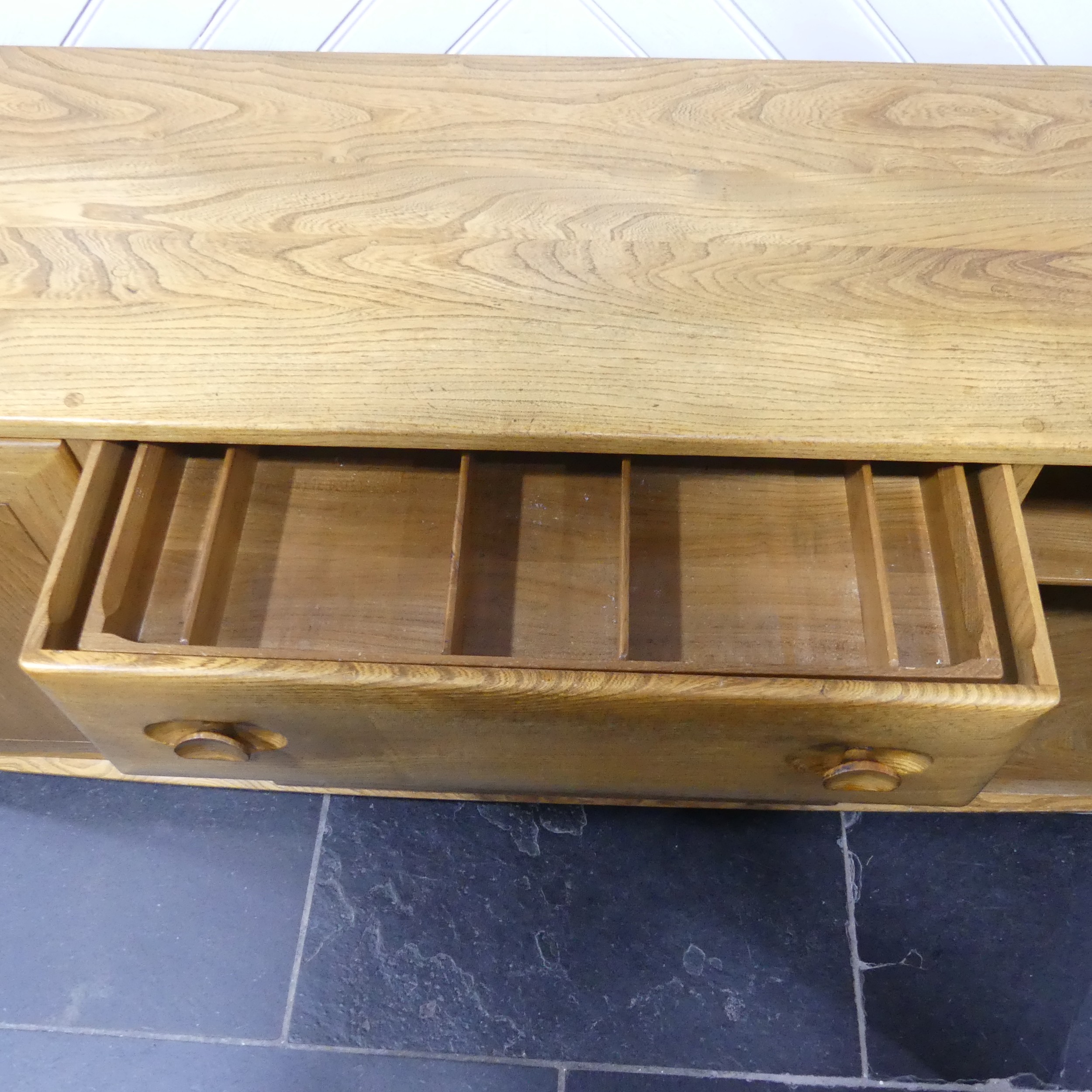 An Ercol "Windsor" blond elm Sideboard, model No. 455, fitted with three central drawers with an - Image 2 of 3