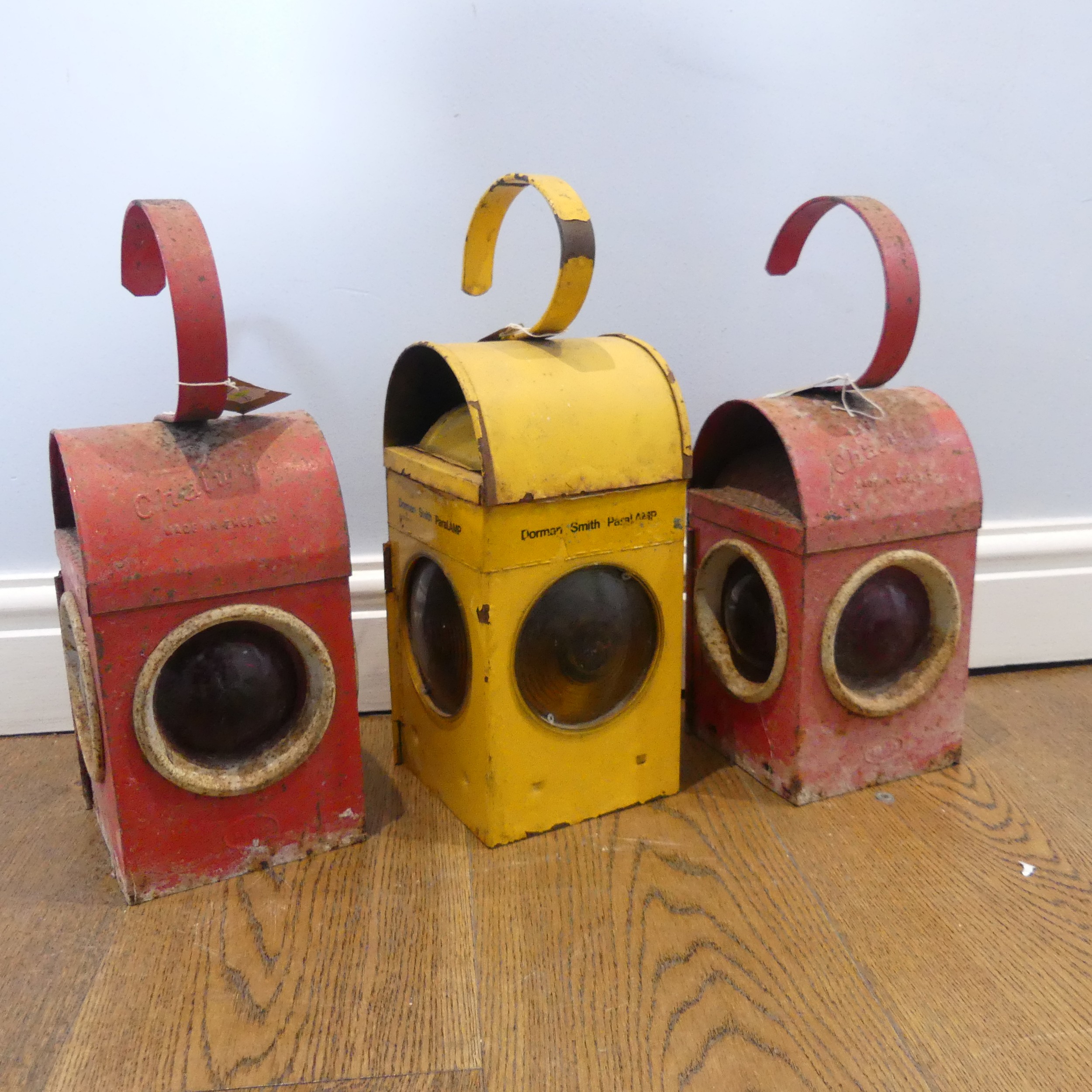 Road Lamps, three road lamps, two Chalwyn lamps, red, and a Dorman Smith Paralamp, yellow, with