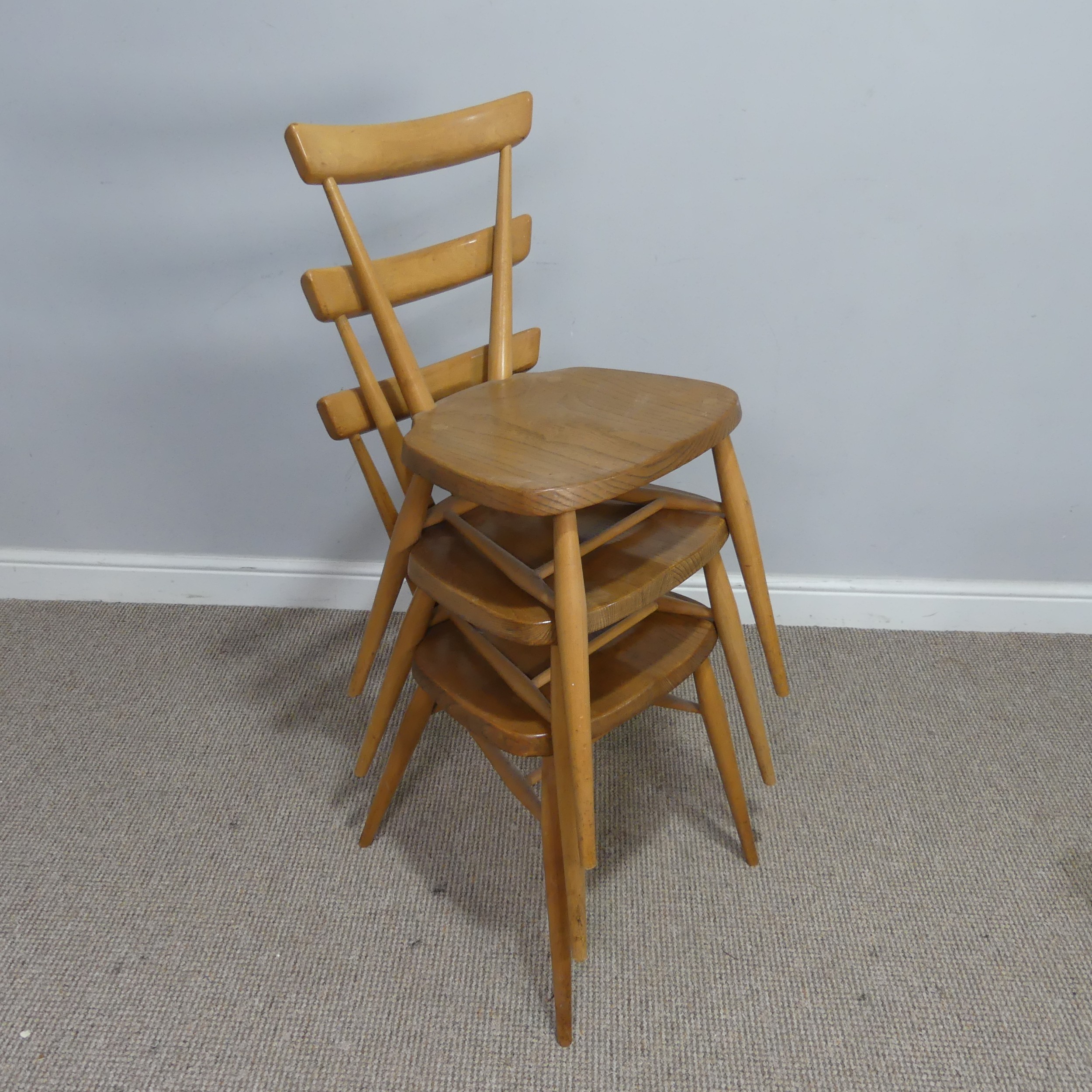 A set of three mid 20th century Ercol stacking Chairs, single slat backs over shaped seats and - Image 4 of 4