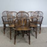 A set of six 19th century ash and elm Windsor Armchairs, spindle and pierced splat backs over shaped
