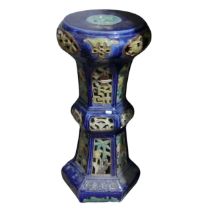 A 20thC Chinese pottery Jardiniere Stand, with pierced apertures, decorated in blues and oranges,