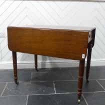 A 19th century mahogany Pembroke Table, with ebony stringing raised on turned supports and brass