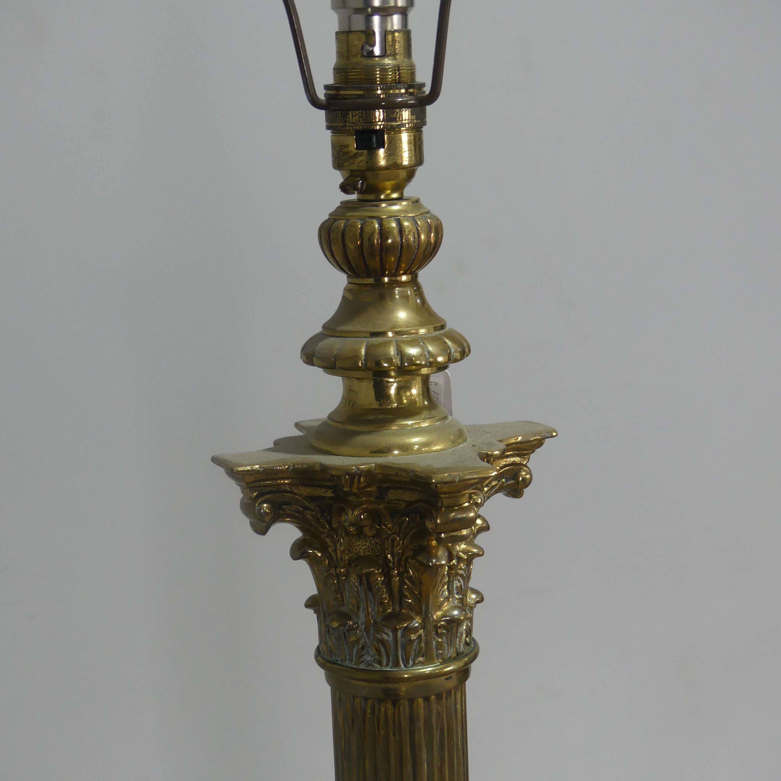 An antique brass standard Lamp, electrified, with corinthian column raised on stepped base and - Image 2 of 3