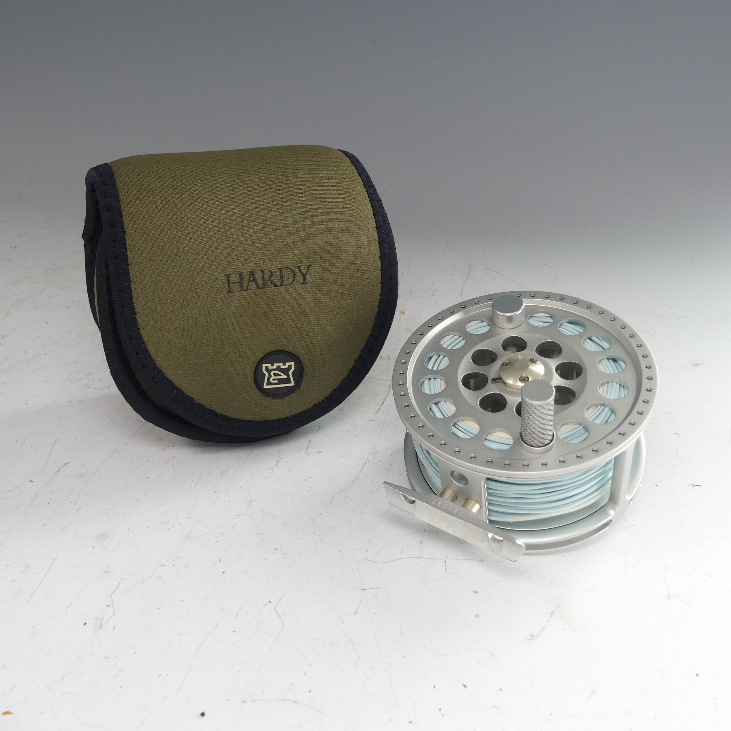 A Hardy Angel 11/12 fishing Reel, no. A26697, with Hardy pouch, 11.5cm diameter. - Image 2 of 8