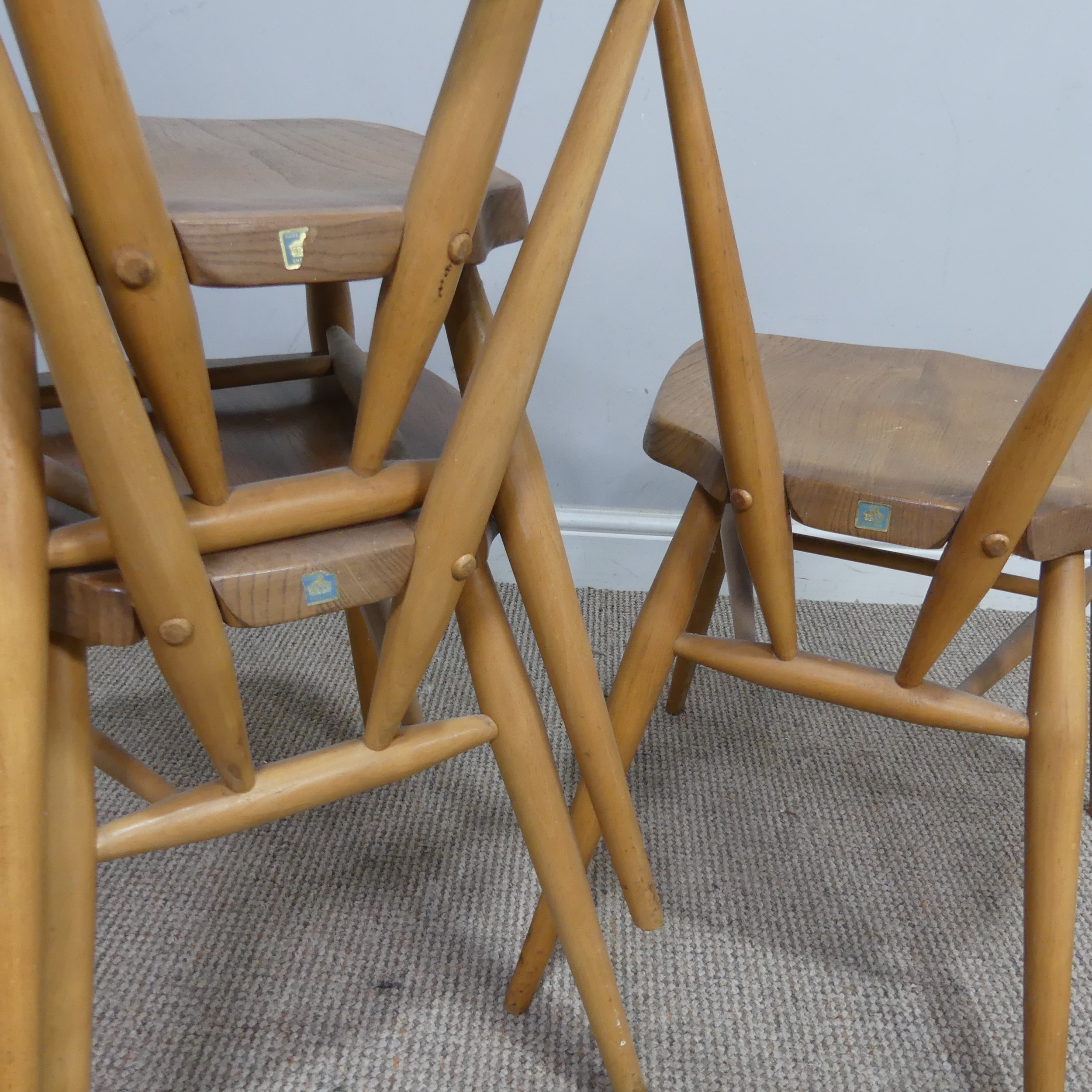 A set of three mid 20th century Ercol stacking Chairs, single slat backs over shaped seats and - Image 3 of 4
