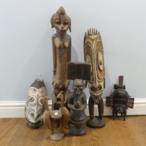 Tribal Artefacts: A Papua New Guineau Sepik Mask, together with a figure similar, and three