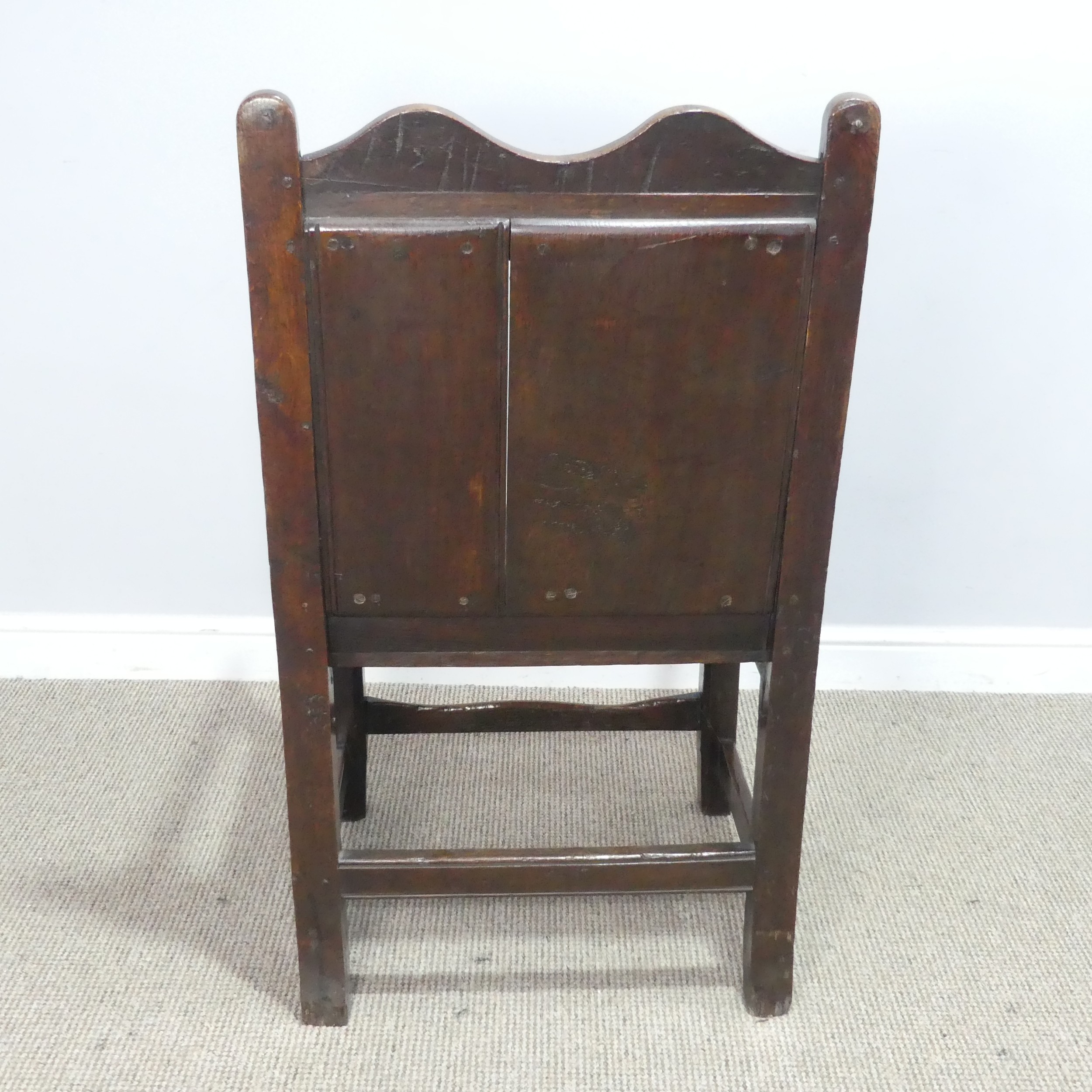 An 18th century wainscot style oak Armchair, shaped headrest over panelled backrest and flanked by - Image 4 of 5