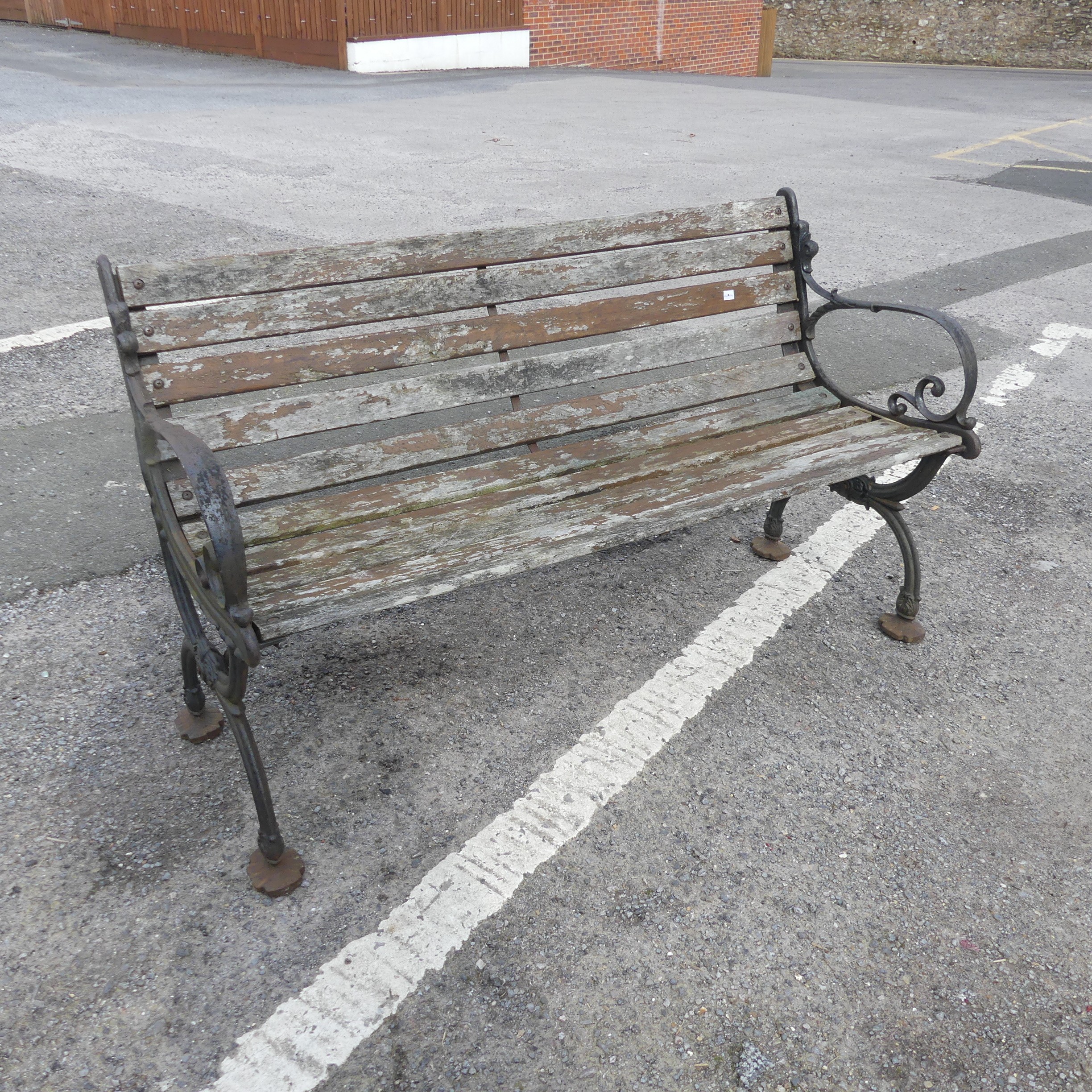 An antique cast iron and teak Garden Seat /Bench, with scrolled supports, W 129.5 cm x H 74 cm x D - Image 4 of 5