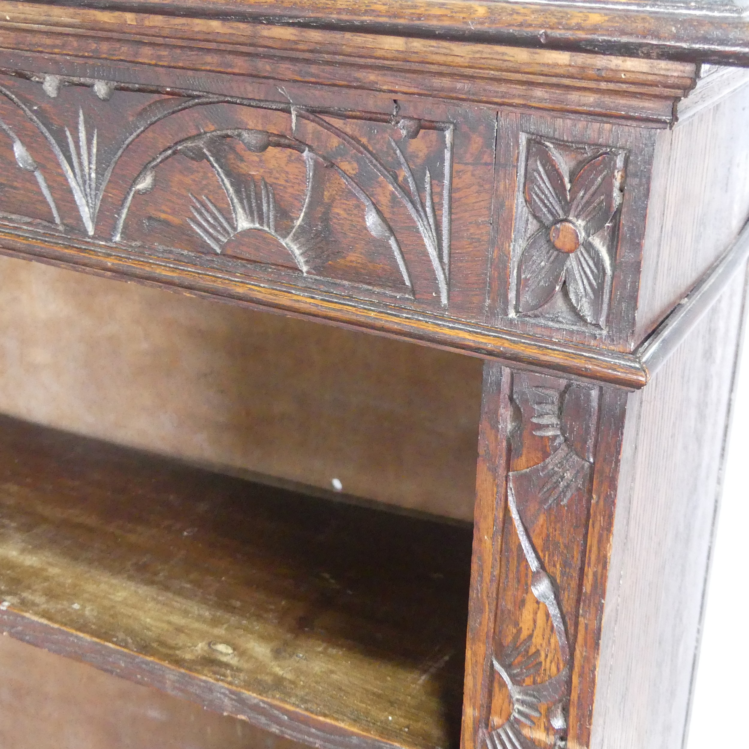 A Victorian carved oak open Bookcase, with retailers plaque, W 91 cm x H 116.5 cm x D 29.5 cm. - Image 3 of 4