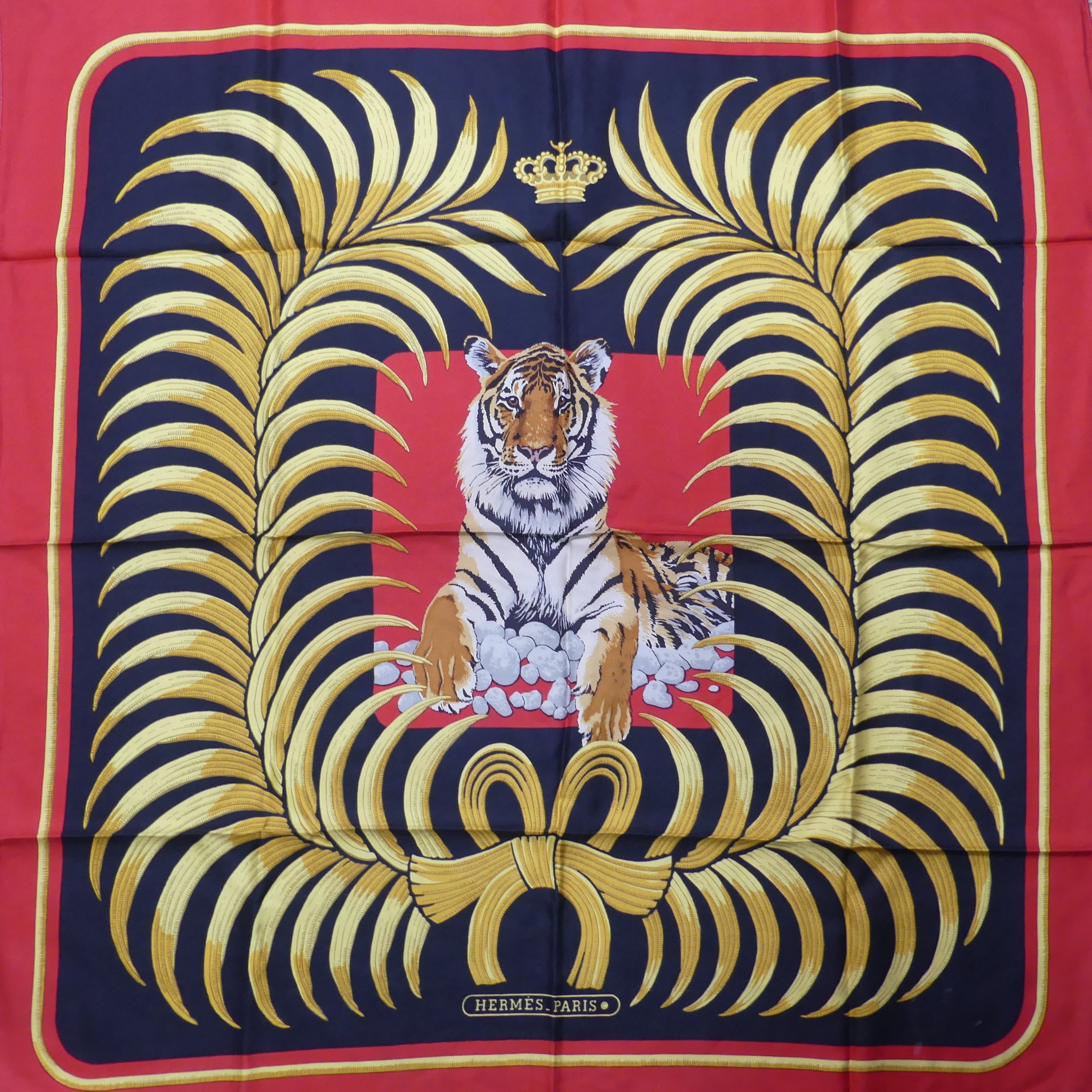 A Hermès silk twill scarf: Royal Tiger design, gold and black on red ground, hand rolled edges, - Image 2 of 2