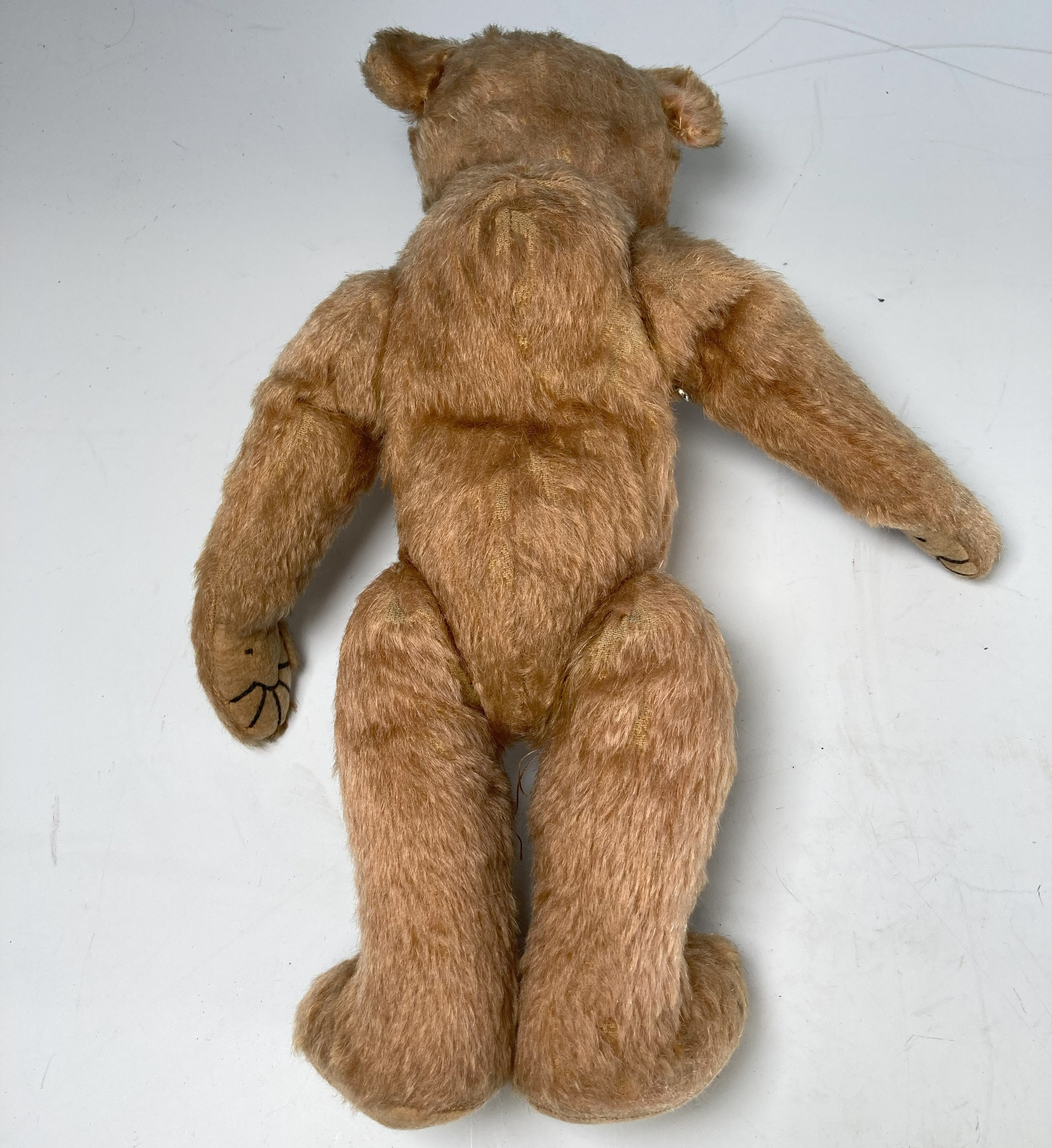 A vintage Teddy Bear, with black button eyes, straw filling, sewn nose, light orange plush and - Image 4 of 6