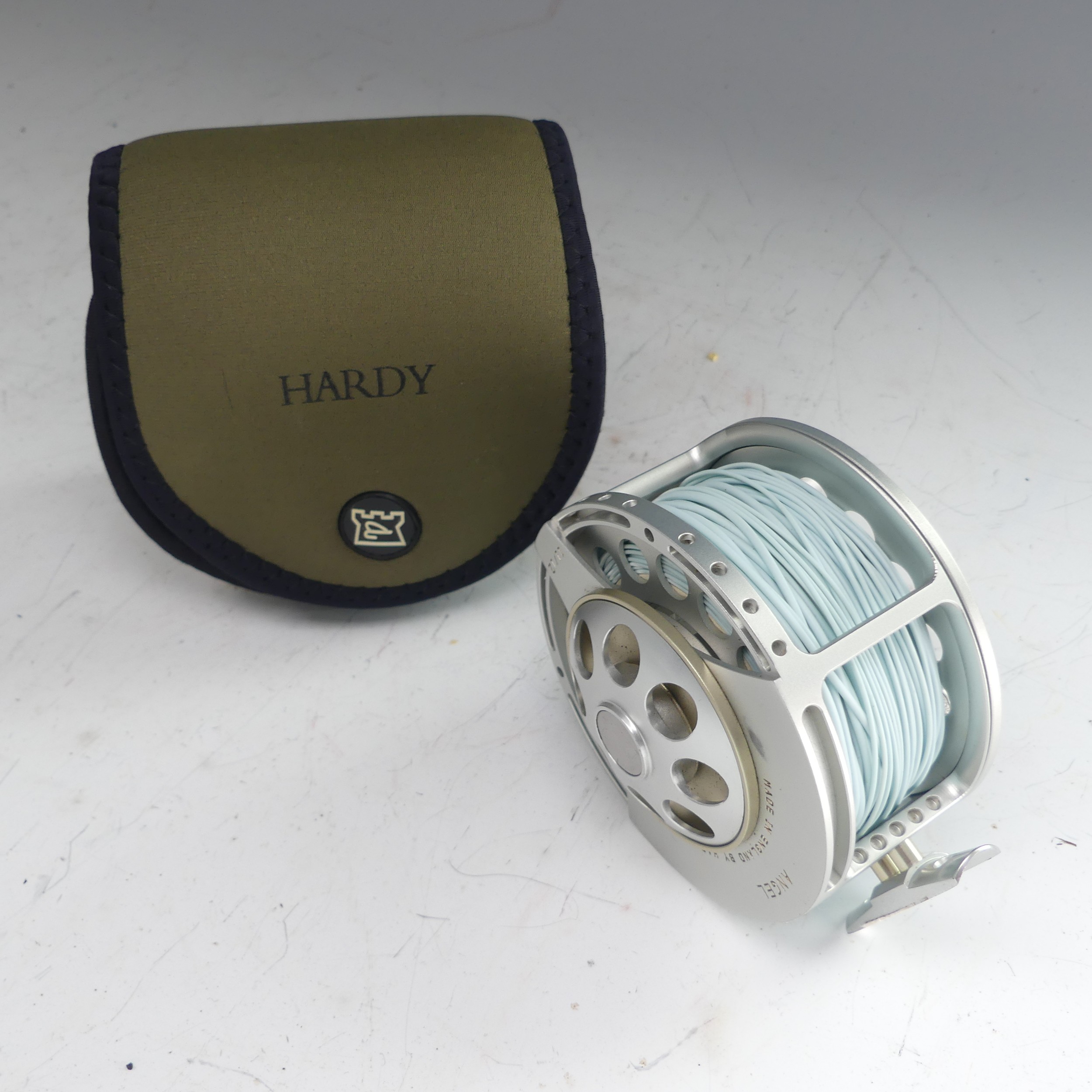 A Hardy Angel 11/12 fishing Reel, no. A26697, with Hardy pouch, 11.5cm diameter. - Image 8 of 8