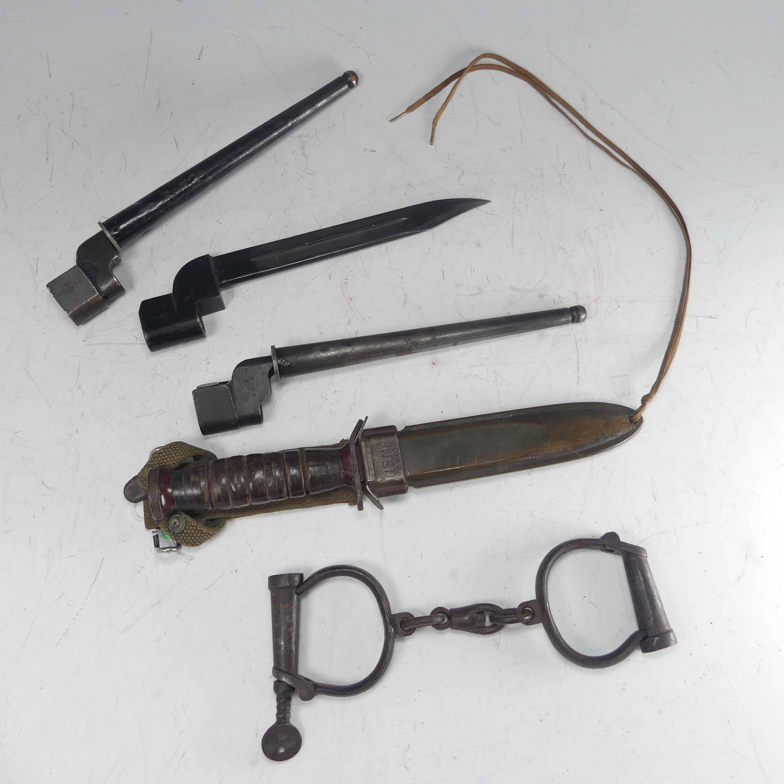 An American USM8 B.M.CO bayonet Knife, with scabbard and material fittings, together with three