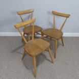 A set of three mid 20th century Ercol stacking Chairs, single slat backs over shaped seats and