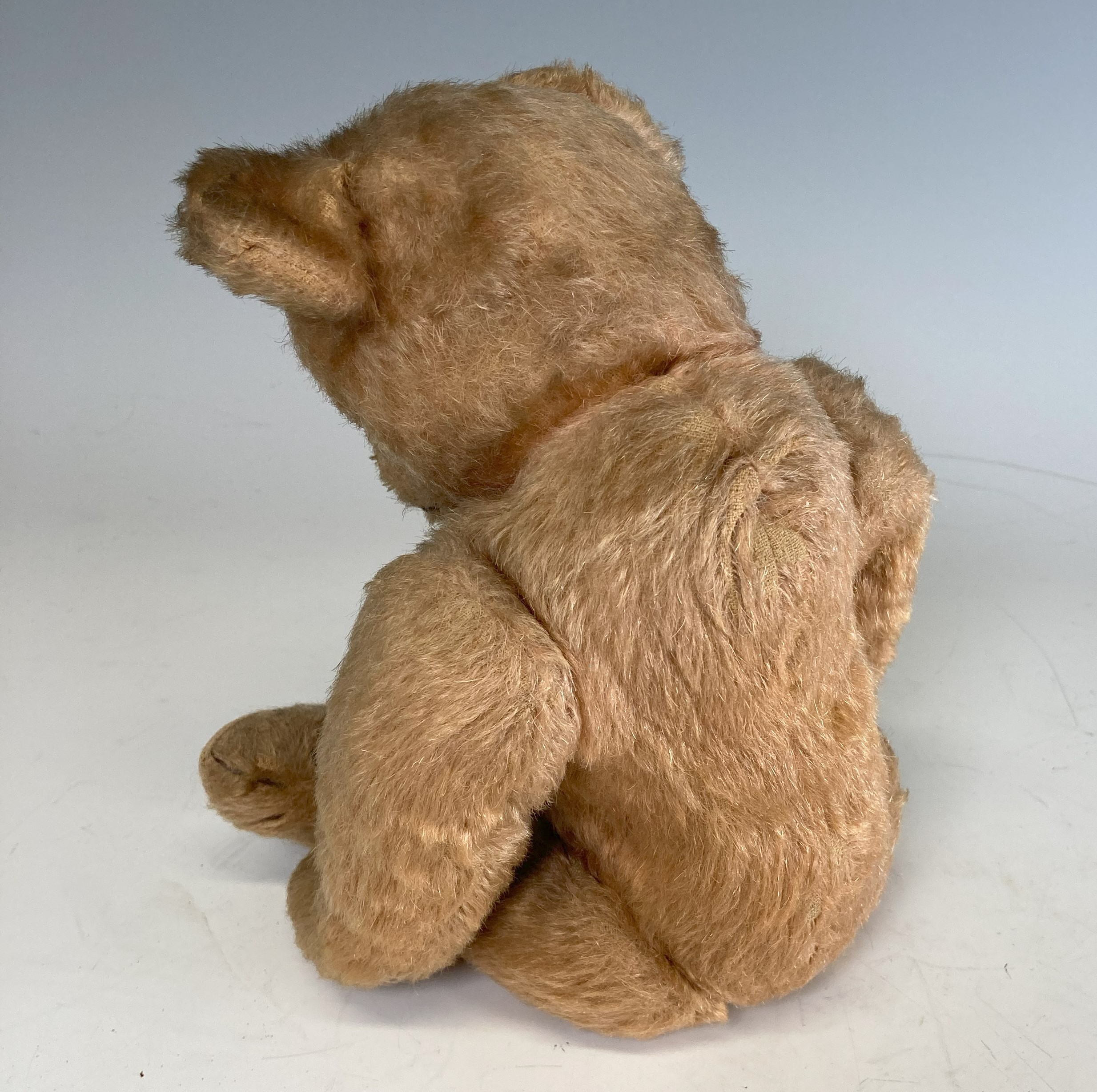 A vintage Teddy Bear, with black button eyes, straw filling, sewn nose, light orange plush and - Image 3 of 6