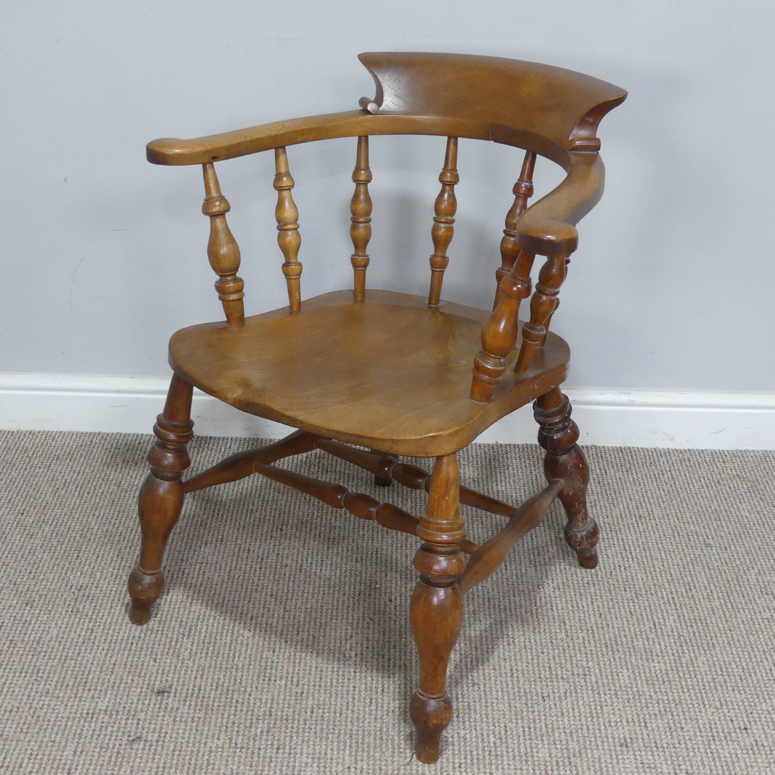 An early 20th century ash and elm Captains / Smokers Bow Armchair, W 66 cm x H 77 cm x D 60 cm. - Image 3 of 4