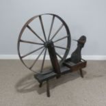 A large late 18th / early 19th century oak country spinning Wheel, W 114 cm x H 114 cm x D 28 cm.