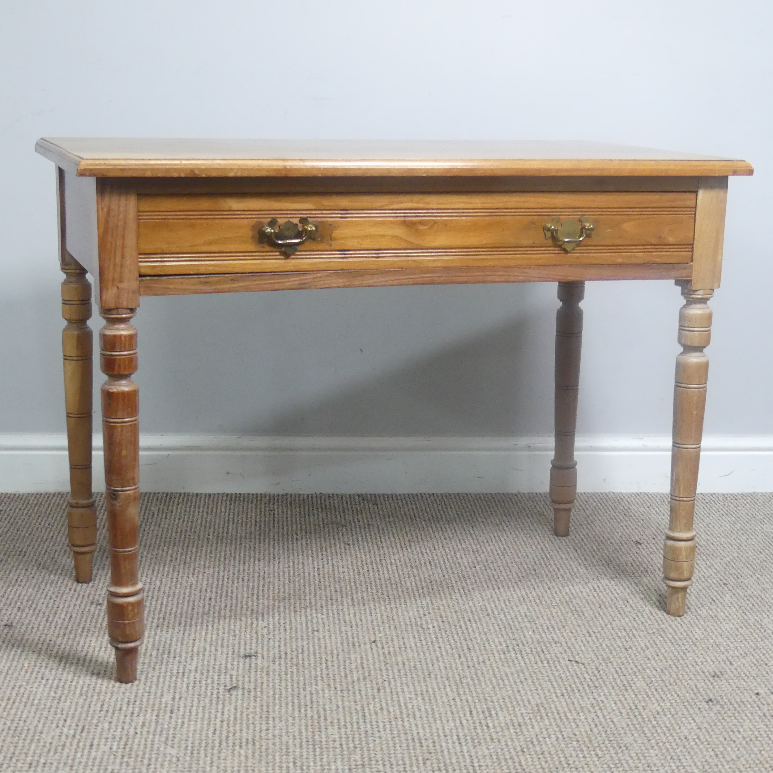 An early 20th century light oak Side Table, with frieze drawer, raise on turned supports, W 92 cm