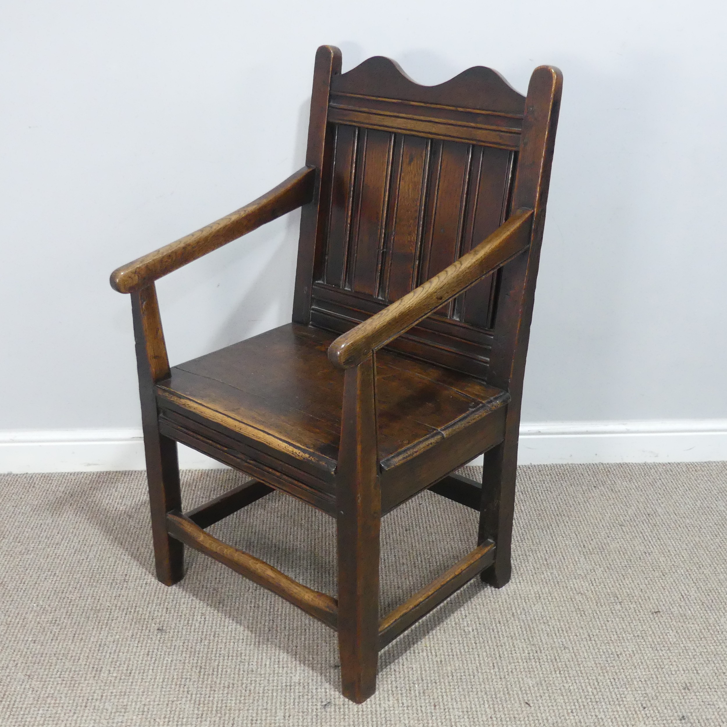 An 18th century wainscot style oak Armchair, shaped headrest over panelled backrest and flanked by - Image 2 of 5