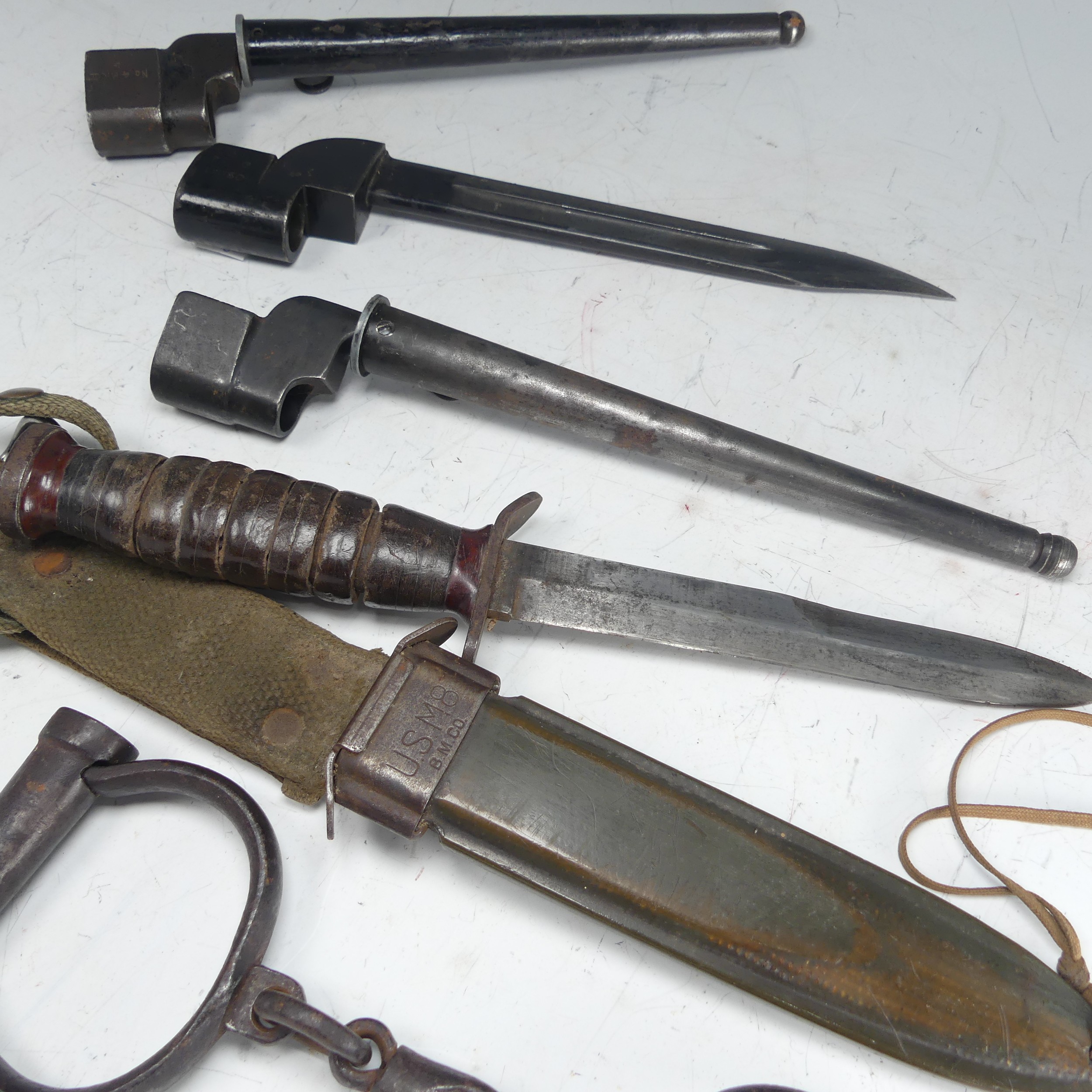 An American USM8 B.M.CO bayonet Knife, with scabbard and material fittings, together with three - Image 4 of 6