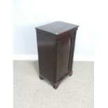 An antique mahogany Pot Cupboard, squared top over cupboard door concealing two shelves, raised on